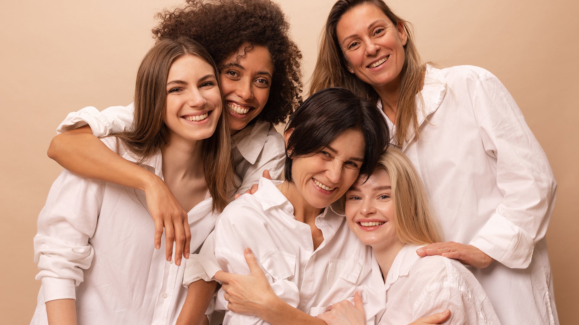 Complice Nation hero: five women on warm beige; discover silk pillowcase, #OhSoFabulous foundation brush, limited-edition hoodie.